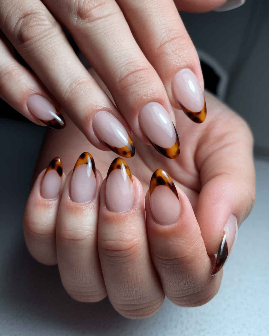 0009_4_a-close-up-photo-of-a-hand-with-nails-th_jZEQab9mRI2JKGEl6llBoA_difQ1ctKTBKS-z1Lr_aQCw The Short Almond Nail Trend That’s Taking Over 2025