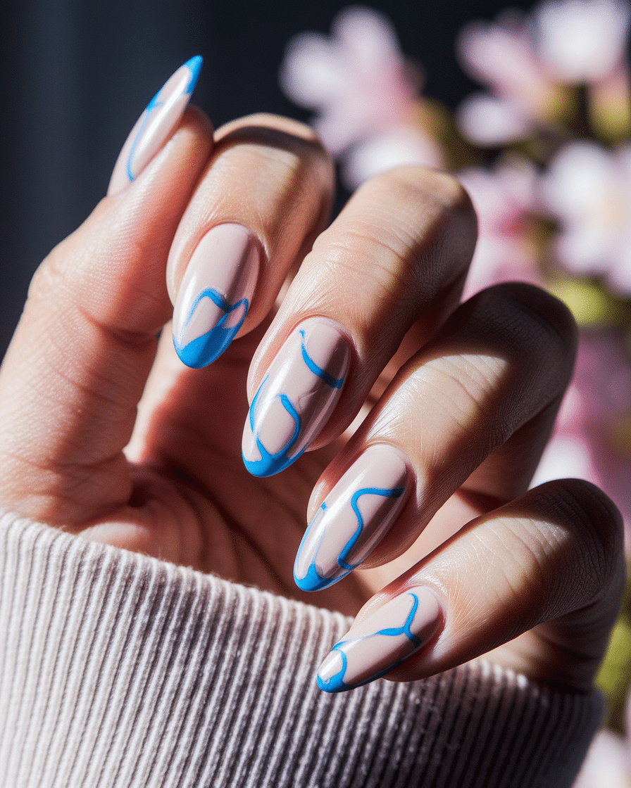 Elegant Minimalist Nail Trends with Blue French Tips and Heart Accents
