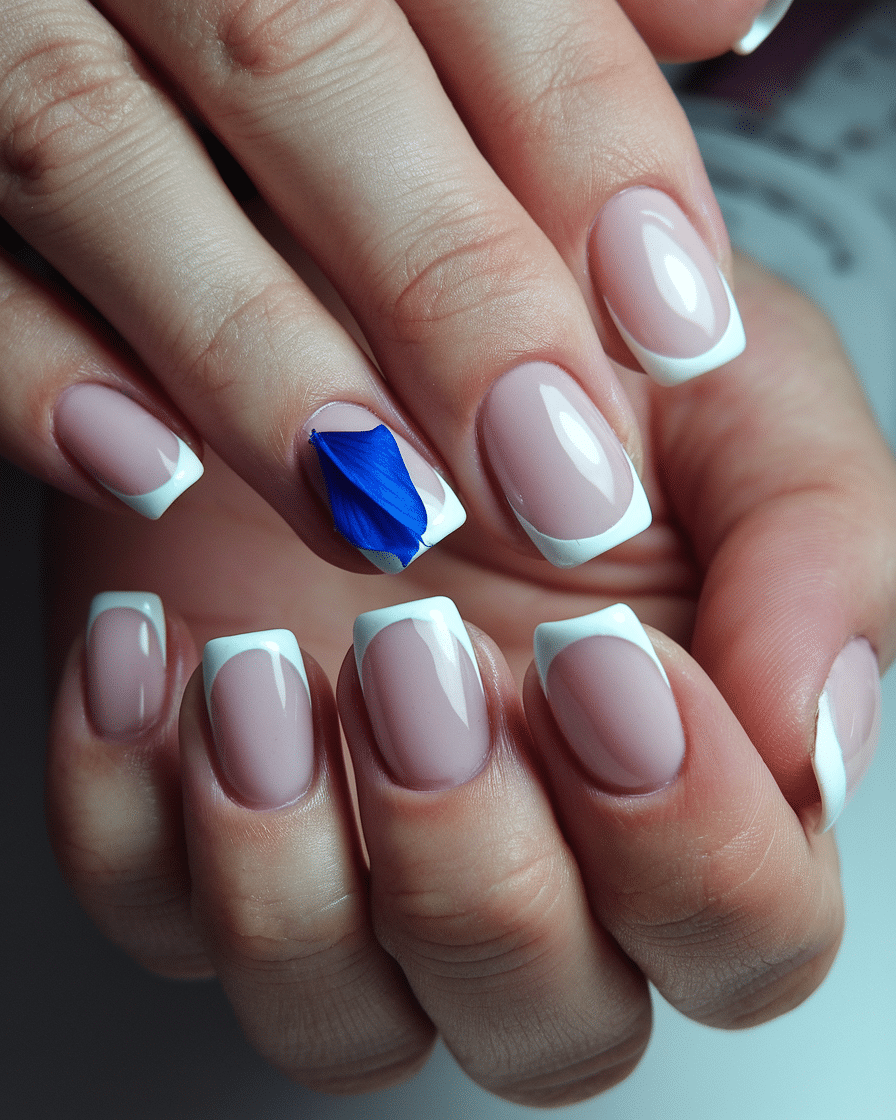 0016_3_a-close-up-photo-of-a-hand-with-french-m_ZgfmcHZZScW0mrNV9f63fg_NH5GuZxQTQuoM5B6cI7rAA_cover Spring Break Nail Trends to Try in 2025