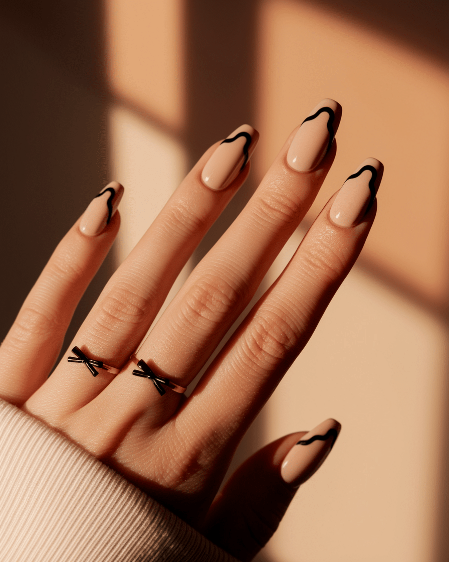Elegant Nail Trends for 2025: Embracing Black Polka Dots, Bows, and Almond Shapes