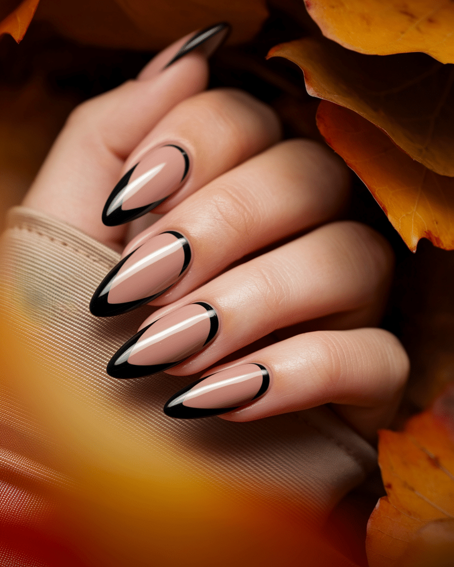 0017_1_a-close-up-photograph-of-a-beautifully-m_1HhvUJsiSOeVoVsWmfz7IQ_VTdF2LNRQam5EIEQWgO58w_cover Elegant Fall Nail Trends: Why Black French Almond Nails Are the Ultimate Seasonal Staple