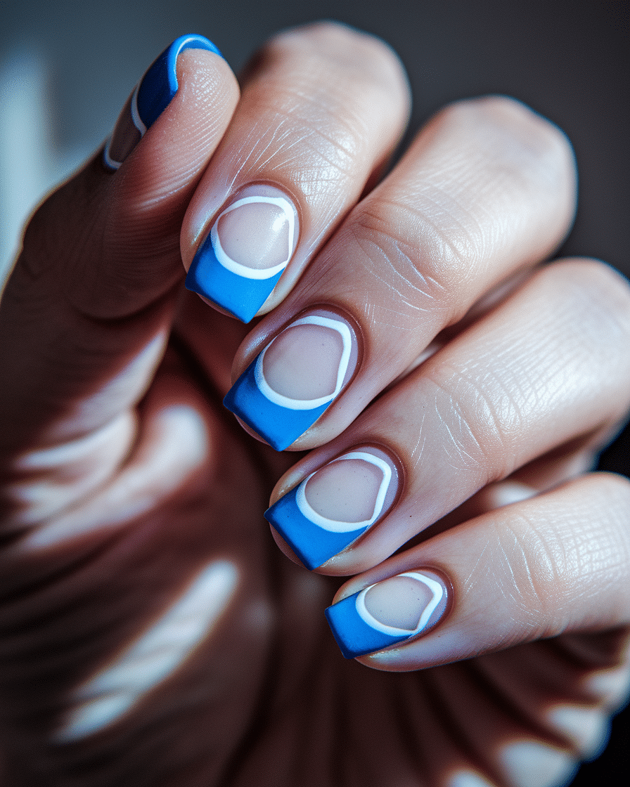 0003_3_a-close-up-photograph-captures-the-intri_VSgZeDaITJunpWj6lDvS_w_ZFhvA_wQRvqeEAyNVmDIIQ Winter Nail Designs with Blue and White for a Chic Seasonal Look