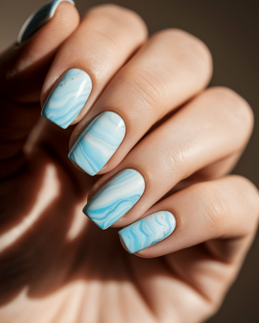 0004_1_a-close-up-photograph-of-a-hand-with-pas_LNKaSJirQk2yNRSN50jhpw_cLCtLe8hT7WDsruA5vKBKQ_cover Blue Acrylic Nail Ideas for a Fresh and Stylish Manicure