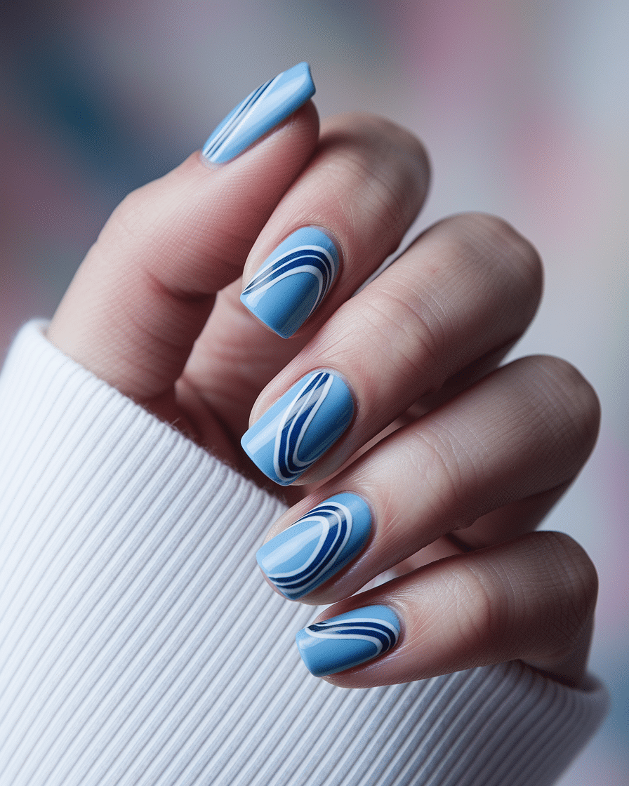 0004_2_close-up-of-a-beautiful-hand-with-baby-b_KrchbVaZQwq-UpJrEOrsrg_VAyo2PE4SkGzyc4BPunmdg Baby Blue Nail Designs That Capture the Essence of Summer