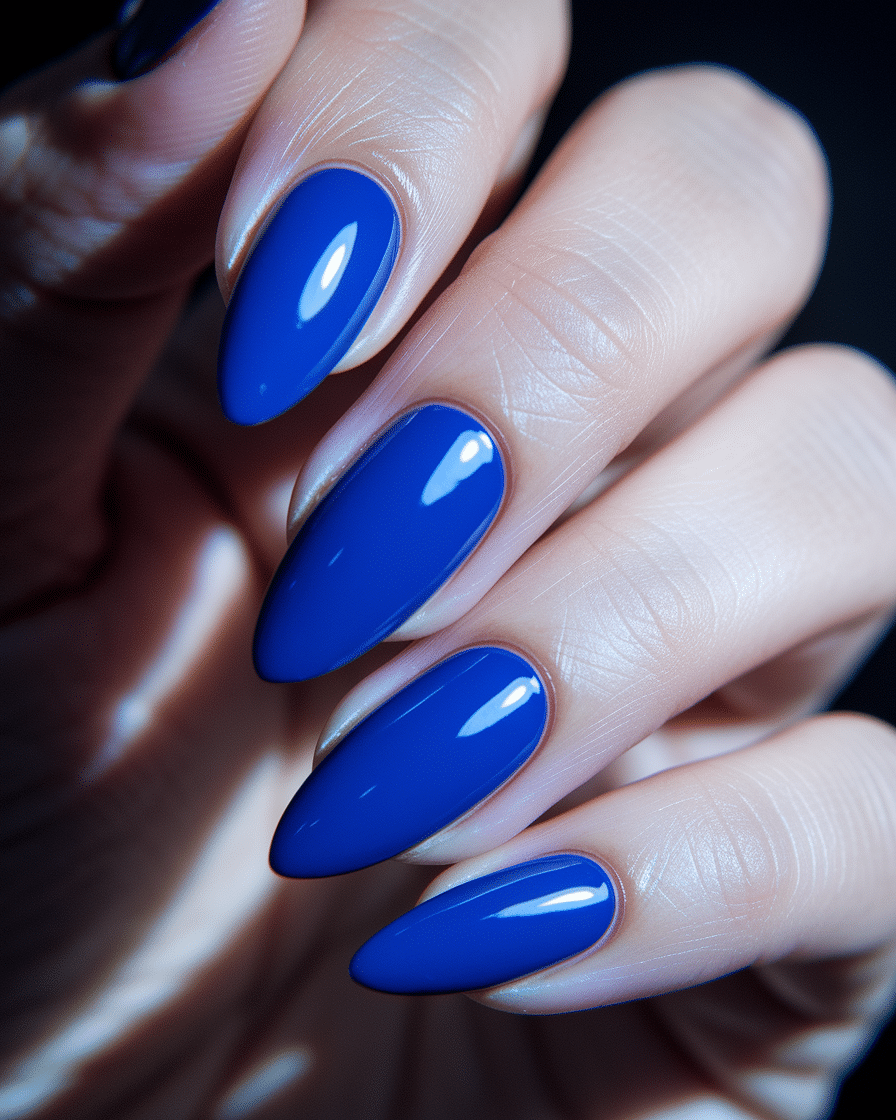 0005_2_a-close-up-photograph-of-a-hand-with-ele_KnJ0qOxLThCBkfQAjVBuHw_-SxQasEaQUyfAuBBuuEKLw Blue Nail Designs for a Fresh, Modern Look in 2025