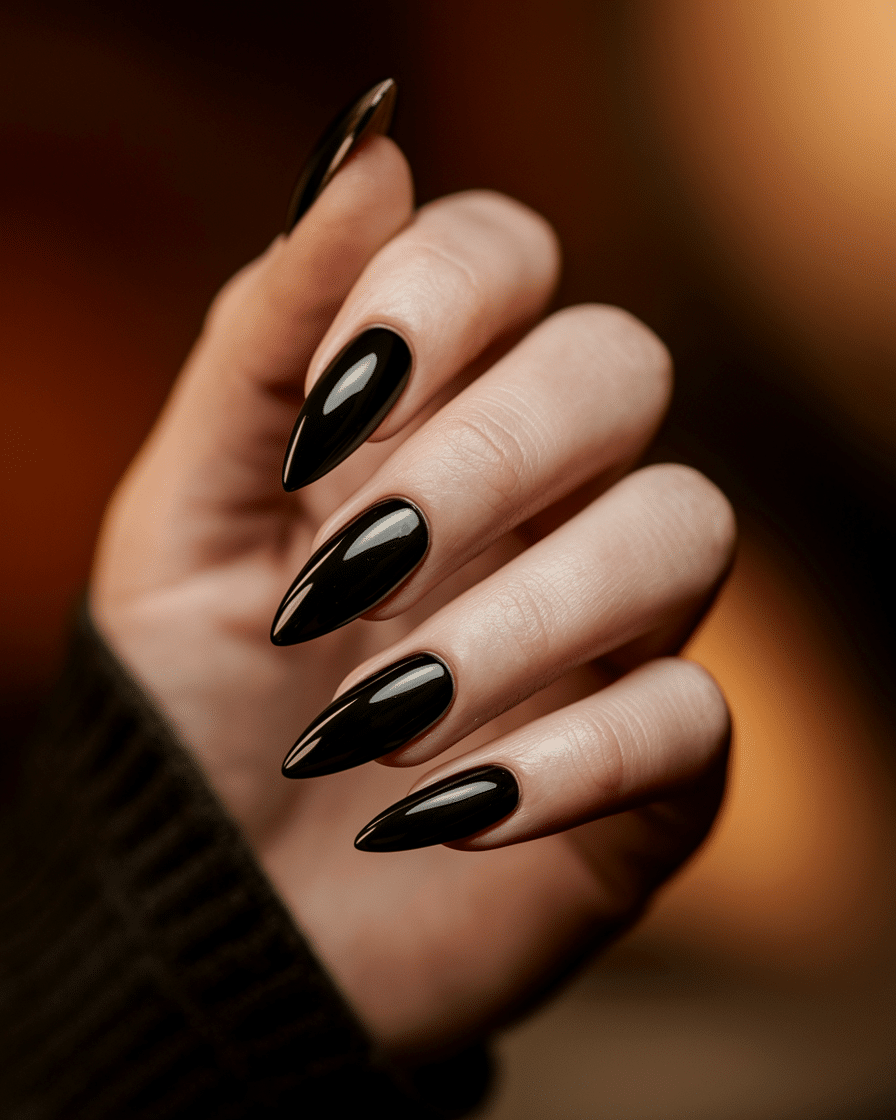0009_1_a-close-up-photograph-captures-the-sharp_RqWhrO_URYyVSkWxe906Rg_37c_mRk9ShGHqmUnsm74OQ_cover The Ultimate Guide to Bold and Elegant Black Nail Designs