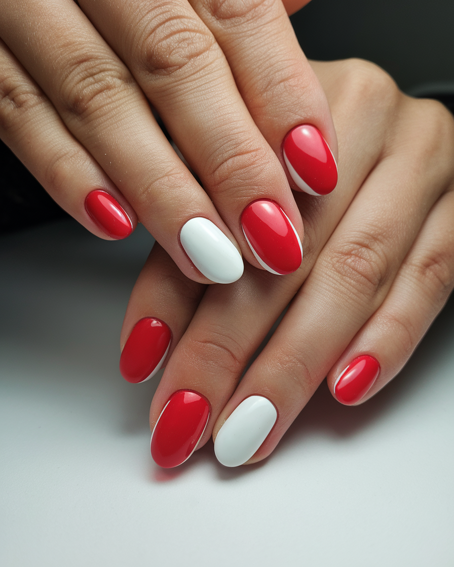 0010_1_a-close-up-shot-of-a-hand-with-red-and-w_6txMYXr5T_exgh2kiQIVLQ_uPyM8AfUTMy2WWy1H2VBsw Vintage Red Nail Ideas That Never Go Out of Style