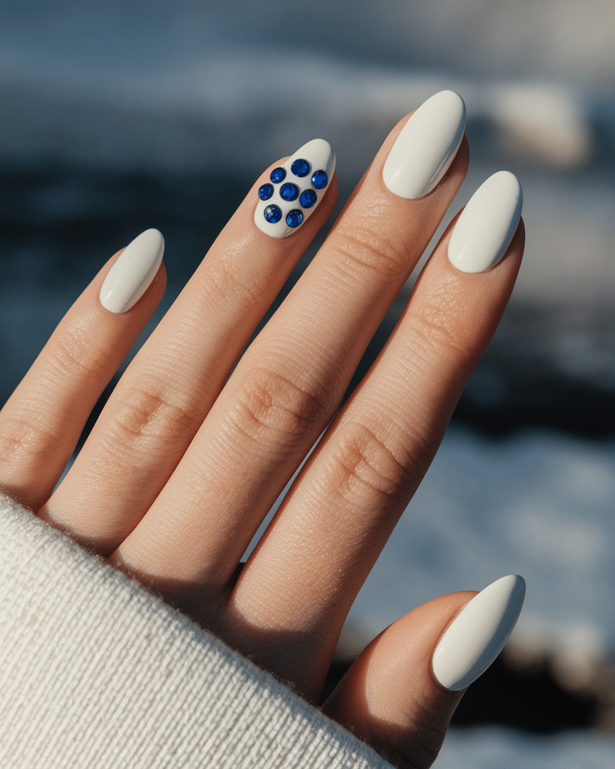 0011_1_close-up-of-a-hand-with-minimalist-white_66v7__saRH-BwJPG7WzMXA_Rflb3SDTTzuk4qWjzkCD5w Elegant Winter Nail Designs with Blue and White Tones