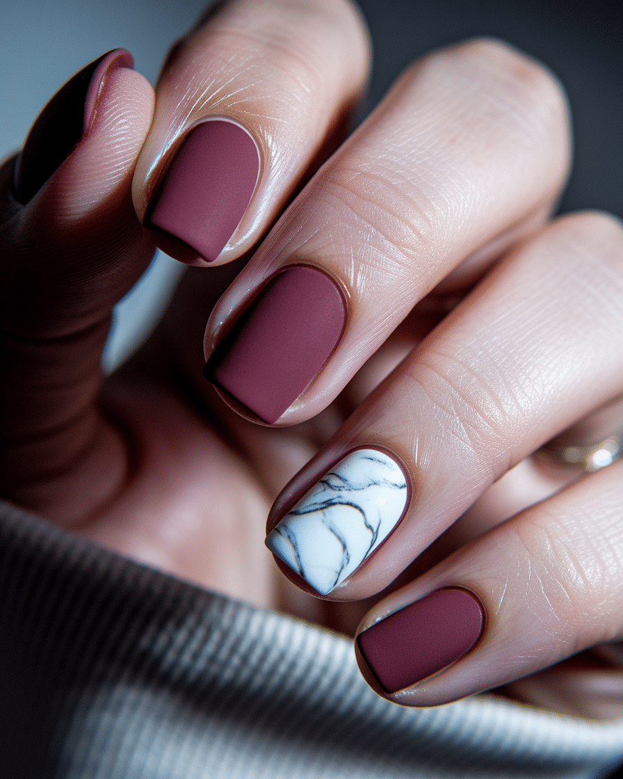 0004_2_a-close-up-photograph-captures-the-intri_IC2mqj_JQny7QpkQglj7sg_n8Od_qtGQ42riwrfLFnRCQ Elegant Nail Styles for Every Season: Matte Burgundy Almond Nails You’ll Adore